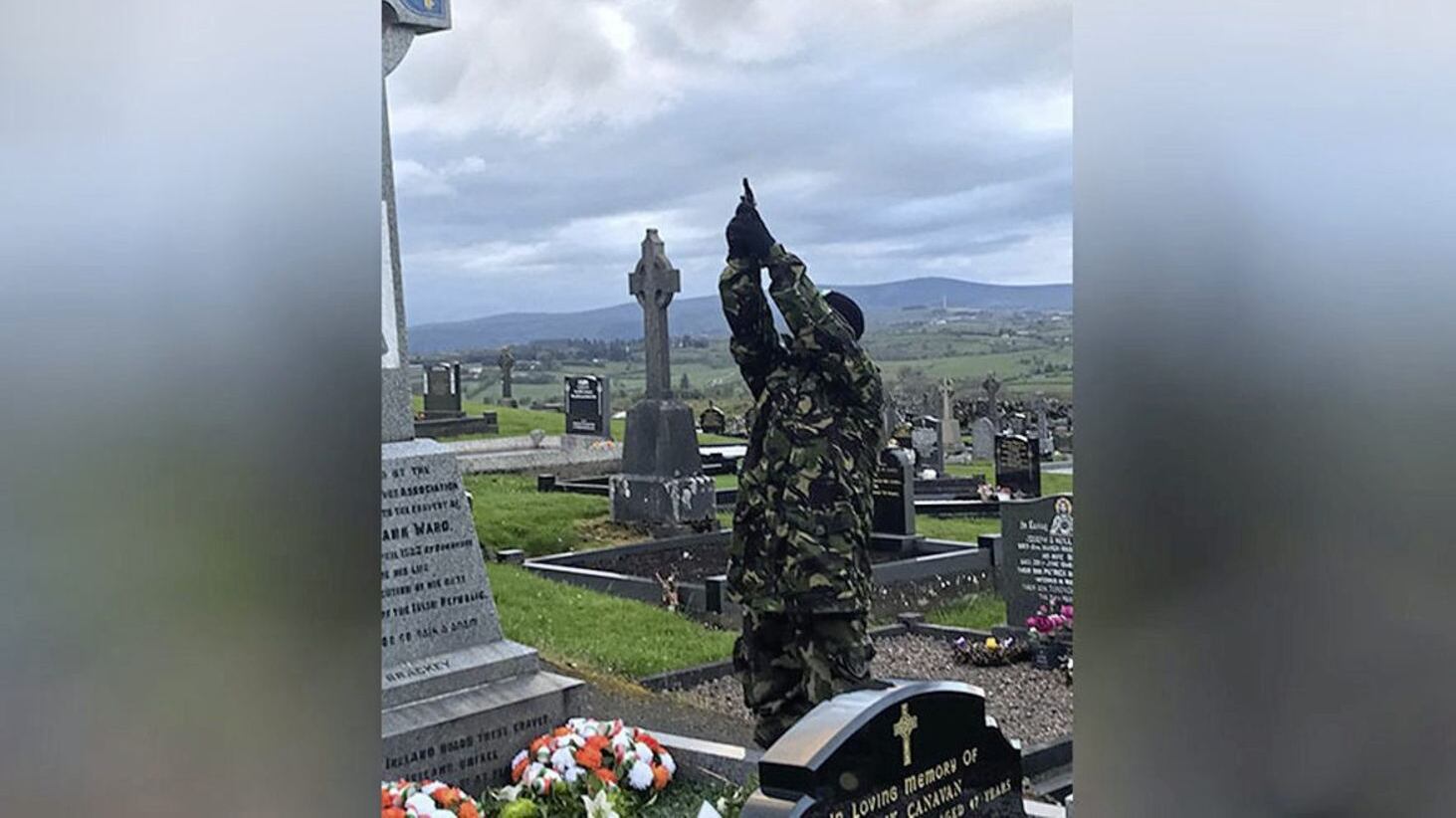 What is believed to be a masked member of the Continuity IRA firing shots over a grave in Co Tyrone on Easter Saturday  