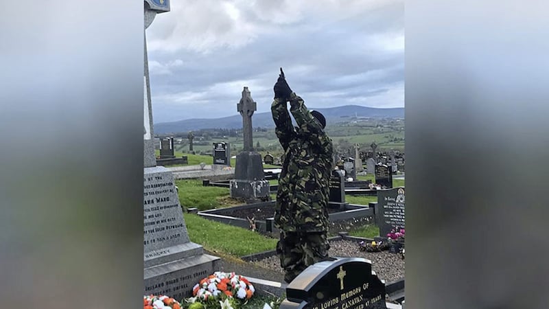 What is believed to be a masked member of the Continuity IRA firing shots over a grave in Co Tyrone on Easter Saturday  