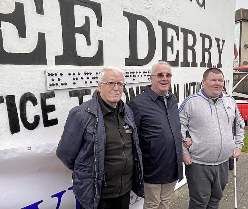 Richard Moore, centre, was joined by John Kelly (left) of the Bloody Sunday families and Brian Walsh from Tuned In Project at yesterday&#39;s unveiling of a Braille translation of the &quot;You are Now Entering Free Derry&quot; slogan.  