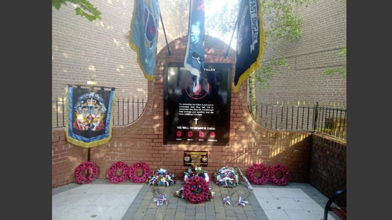 Loyalist paramilitary flags and a temporary plaque were placed on the memorial in south Belfast 