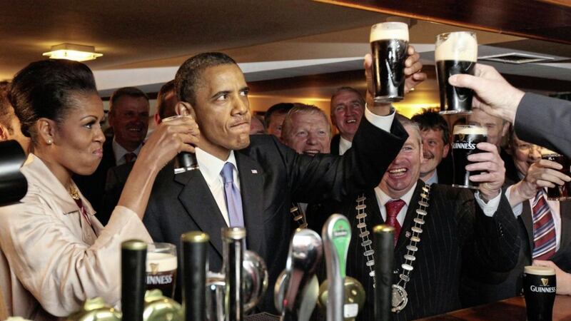 US president Barack Obama and First Lady Michelle Obama enjoying a Guinness in Hayes Bar in Moneygall, Co Offaly during their ancestral visit to the Republic in 2011. The outgoing leader says he is returning to Ireland 
