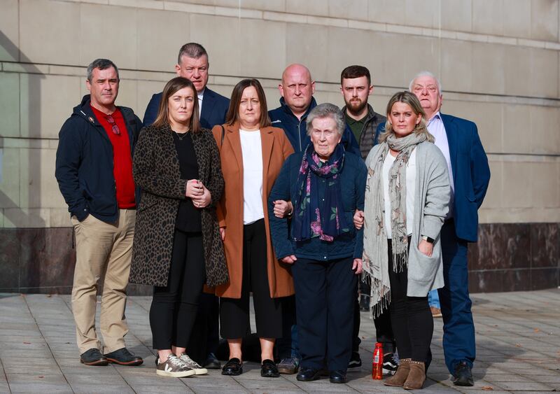 The widow of murdered GAA official Sean Brown, Bridie Brown (fourth from right) with family and friends and their lawyer outside court at a previous hearing