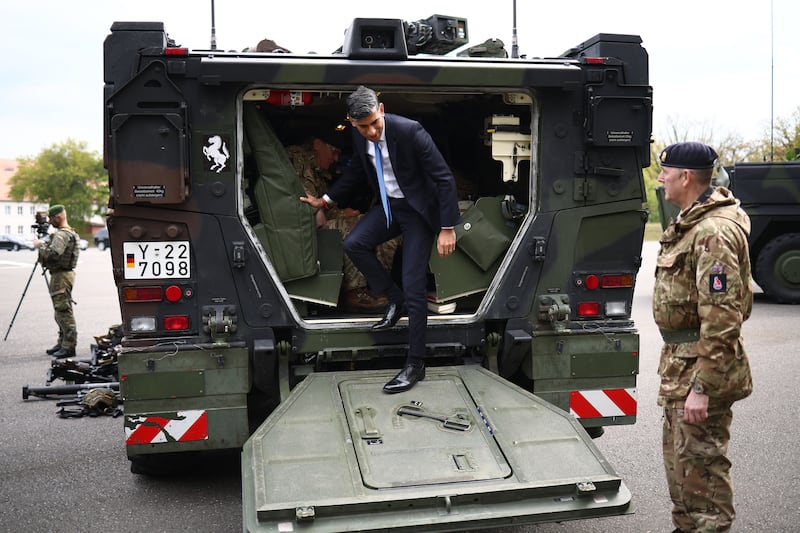 Prime Minister Rishi Sunak disembarks from a Boxer military vehicle