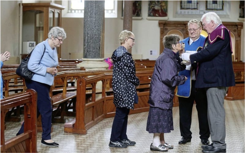 People queue to venerate the Relic of St Teresa of Calcutta at St Patrick&#39;s Church in Belfast. Picture by Hugh Russell. 
