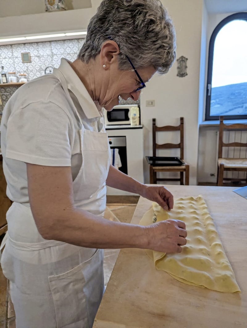 Maya, one of the Italian cooks teaching pasta making
