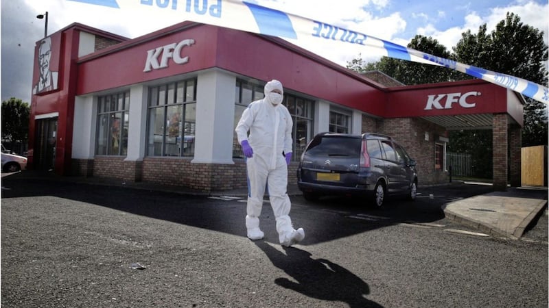 Forensics at the scene of a sudden death at a KFC outlet in north Belfast. Picture by Hugh Russell 