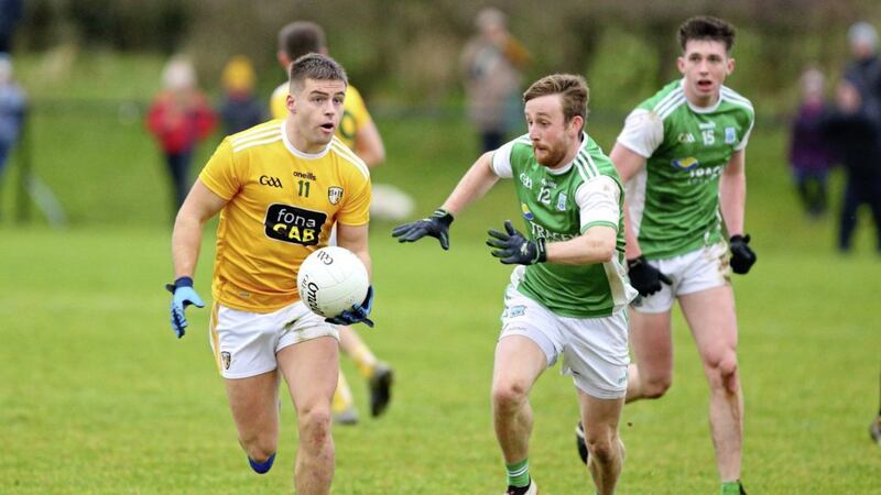 Antrim's Patrick McBride tries to get away from Fermanagh's Ciaran Corrigan and Tiarnan Bogue. McBride delivered a man-of-the-match display grabbing two second half goals. Picture: Cliff Donaldson.