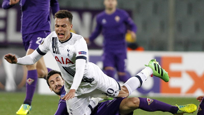 Fiorentina's Davide Astori tackles Tottenham's Dele Alli during Thursday's Europa League round-of-32 first leg at the Artemio Franchi stadium in Florence<br />Picture by AP
