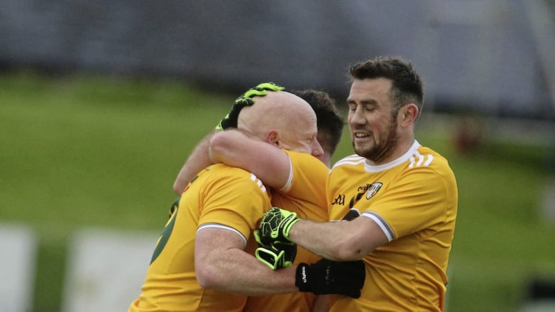 Antrim&#39;s Paddy Cunningham celebrates with his team-mates after scoring the winning point in the Saffrons&#39; Allianz Football League Division Four match with Sligo at Corrigan Park on Saturday Picture: Hugh Russell 