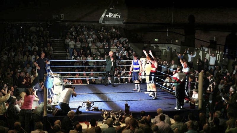 MC Jim Noonan announces the judges&#39; scorecards at the 2008 Ulster senior finals in the Andersonstown Leisure Centre, with Shane McGuigan having his hand raised after a close welterweight final. Picture by Brendan Murphy 