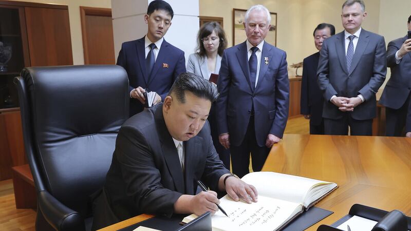 North Korean leader Kim Jong Un signs a book during his visit to a Russian aircraft plant that produces fighter jets in Komsomolsk-on-Amur (Korean Central News Agency/Korea News Service/AP)