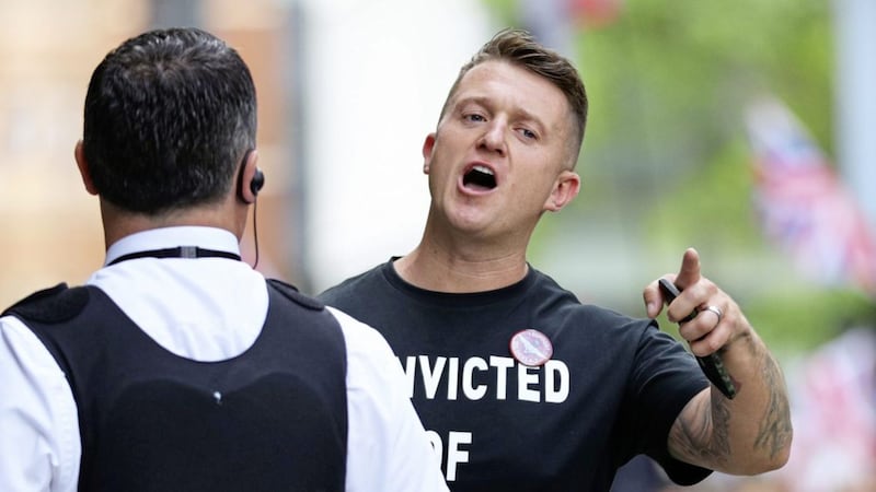 Tommy Robinson wearing a badge with the slogan &quot;I support soldiers A-Z&quot; as he arrives for his sentencing at the Old Bailey in London on Thursday. Picture by Aaron Chown, Press Association 