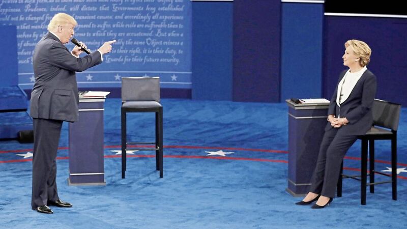 Donald Trump gestures to Hillary Clinton during the second presidential debate. Mr Trump has said he lost the popular vote because of illegal immigrants voting for the Democratic candidate 