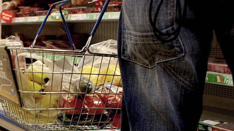 Visits to supermarket grocery aisles in Northern Ireland are up - and prices are down - according to separate reports 