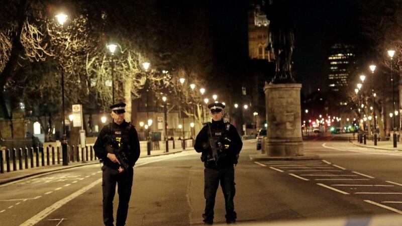 Two policemen stand guard at a cordoned off area on the way to the Houses of Parliament in central London. Picture by Matt Dunham, Associated Press 