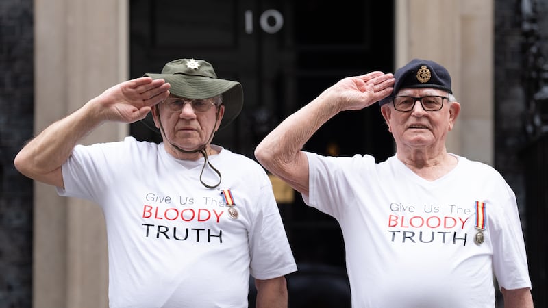 Veterans of Britain’s Cold War radiation experiments Terry Quinlan (left) and Brian Unthank (right) hand a petition in at Downing Street