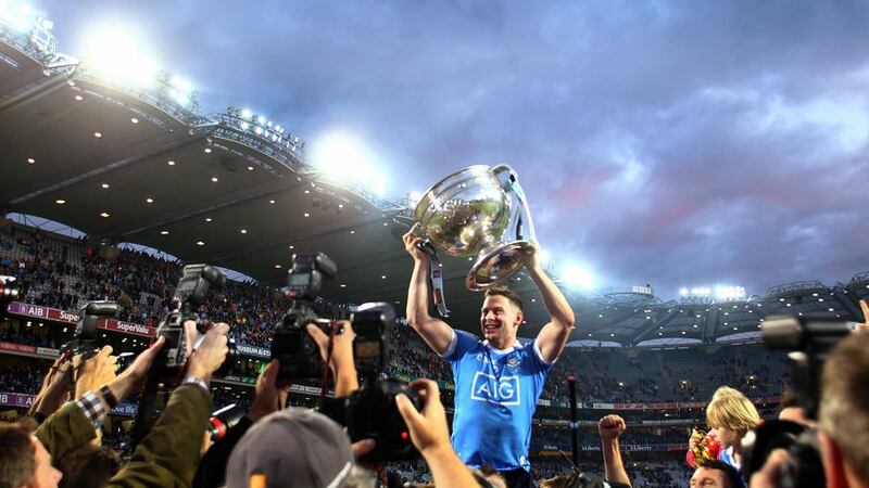 Dublin's Philly McMahon holds the Sam Maguire aloft in front of Hill 16 after their win in this year's All-Ireland final replay at Croke Park<br />Picture by S&eacute;amus Loughran