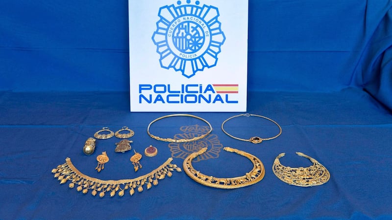 Pieces of ancient gold jewellery are displayed after being recovered by Spanish police (Policia Nacional via AP)