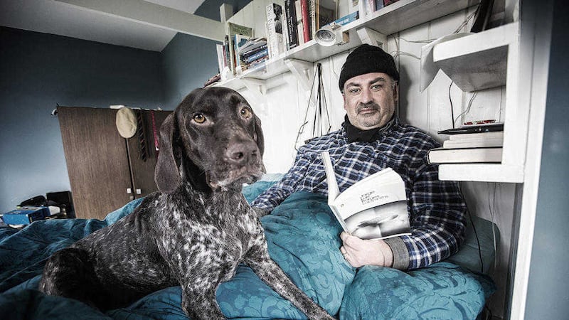 Playwright Jimmy McAleavey with German Pointer Nelly in his specially-adapted writing bed. Picture by Brian Morrison&nbsp;