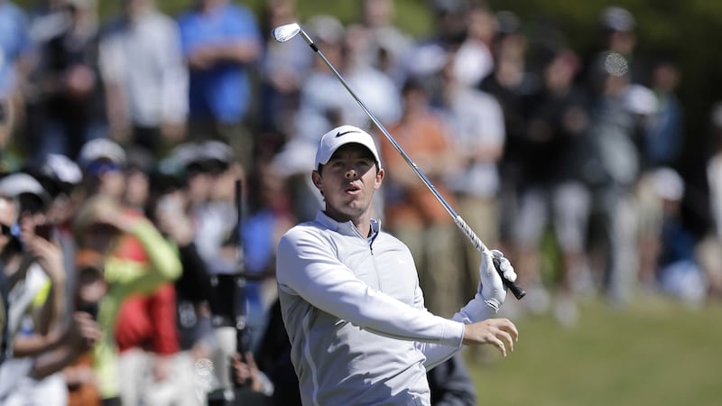 Rory McIlroy watches his shot on the second hole during round-robin play against Kevin Na at the Dell Match Play Championship at Austin County Club on Friday<br />Picture by AP&nbsp;