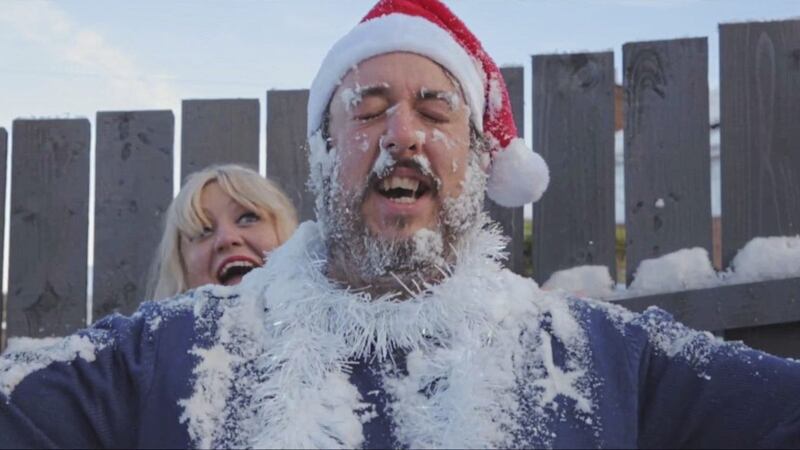 Owen Lamont getting festive with Katie Richardson in the video for Lovely Time of Year 