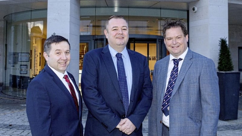 UUP leader Robin Swann with new Antrim councillor Robert Foster and council group leader Mark Cosgrove 