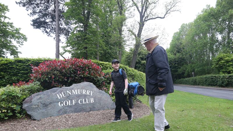 &nbsp;11 year old Aaron O'Reilly with his grandfather Kevin arrive at Dunmurry Golf Club in Belfast which has received dozens of new applications for membership as courses opened for the first time in weeks.