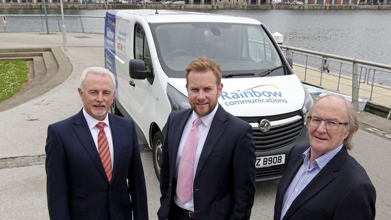 Celebrating 20 years of Rainbow Communications are its founders and co-directors Martin Hamill (left) and Eric Carson (right) with sales and marketing director Stuart Carson 