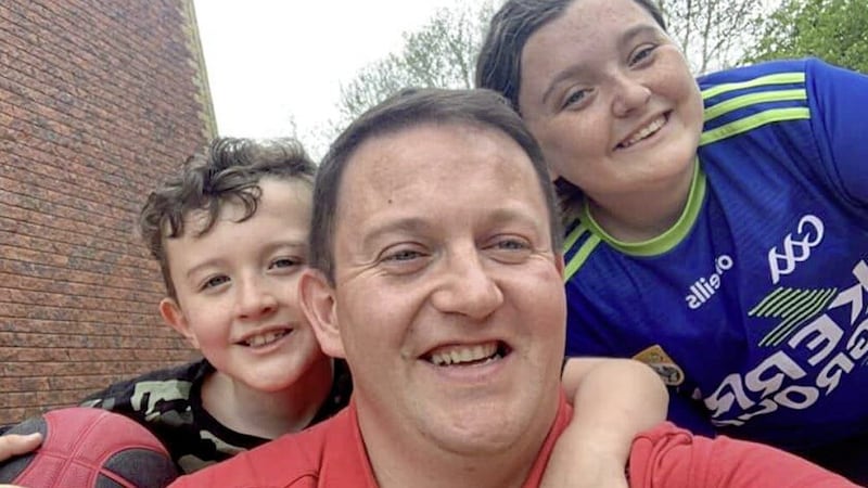 Aaron Law (34) with his children Grace (15) and Harry (10). Picture: PSNI 