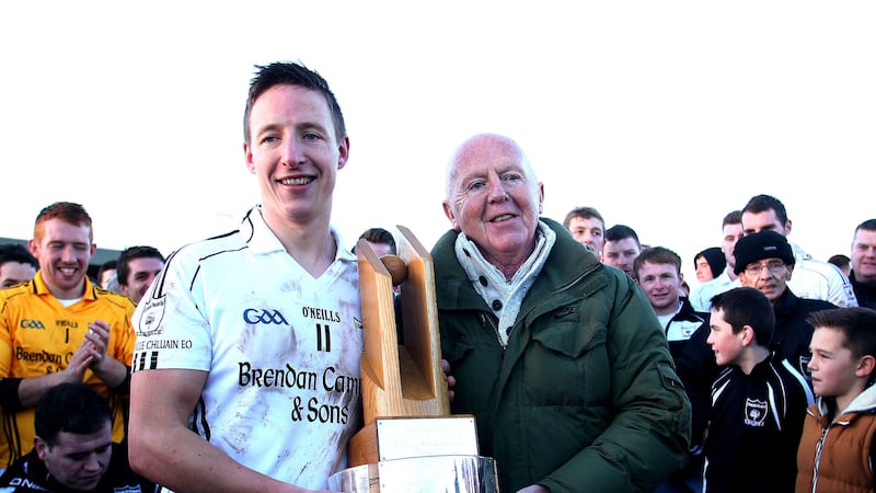 Clonoe O'Rahilly's captain Patrick Doris is presented with the Tyrone Division One trophy by Tyrone CCC member Adrian Scullion at O'Neill Park, Dungannon in 2015 <br />Picture by Seamus Loughran&nbsp;