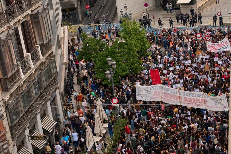 Activists protest near the Spanish parliament (Manu Fernandez/AP)