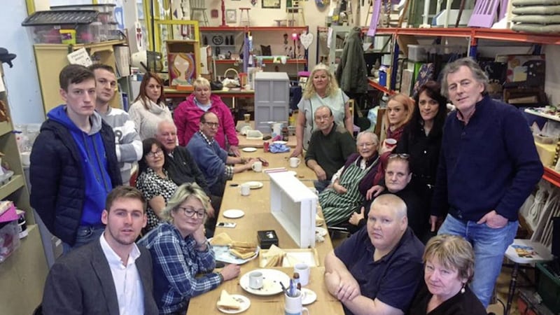 Alliance councillor Patrick Brown (front left) pictured with users of the Downpatrick Social Enterprise Hub including director Manus Teague (standing right). The group must vacate their premises by March 21 