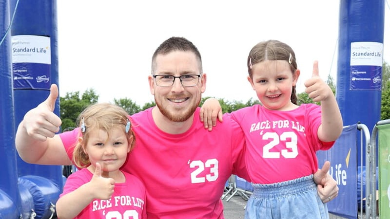 Lisburn’s Kieran Drinkwater pictured at Sunday’s Race for Life event at Stormont with daughters Eliza and Ivy