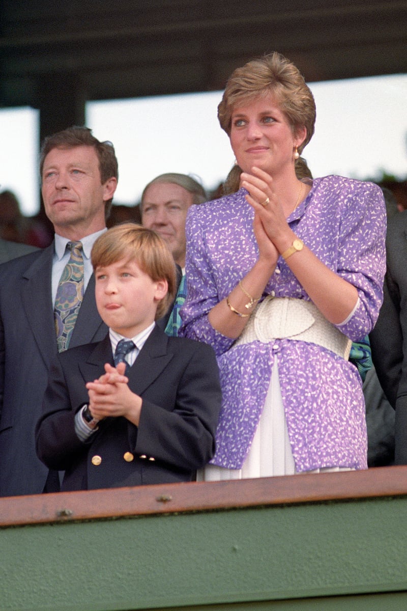Diana, Princess of Wales and Prince William stand and applaud in the Royal Box on Centre Court at Wimbledon in 1991