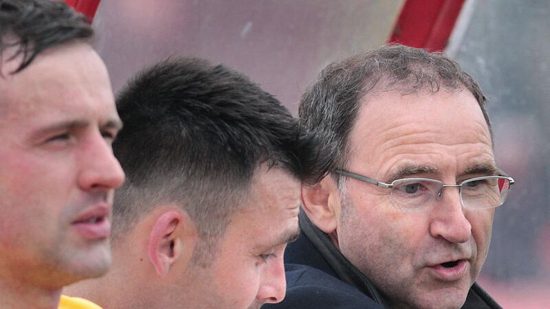Martin O&#39;Neill and Derry GAA star in the dugout during the match for Mark Farren. Picture by Margaret McLaughlin 