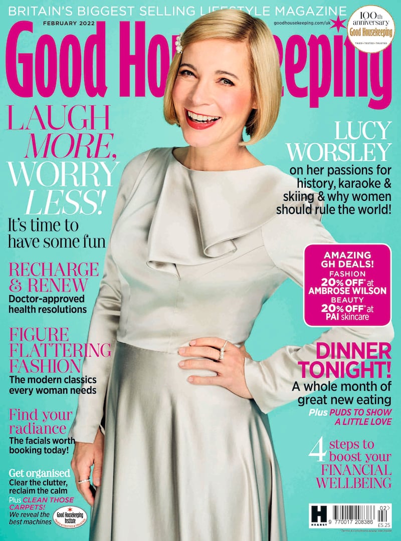 Lucy Worsley smiling with her hand on her hip.
