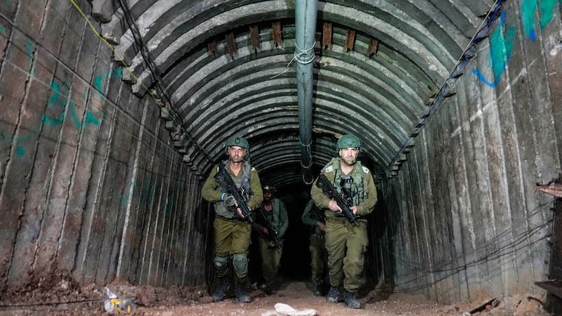 Israeli soldiers are seen in a tunnel that the military says Hamas militants used to attack the Erez crossing (Ariel Schalit/AP)