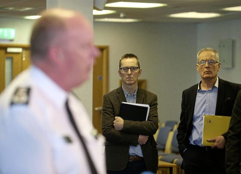 SInn Fein policing board members Gerry Kelly and Philip McGuigan listen to the Psni Chief Constable George Hamilton speaking after a private meeting with the Policing Board Picture Mal McCann. 