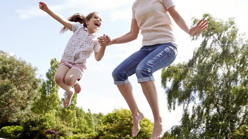 Playing together can be good exercise for mothers as well as their children - and can be fun too. 