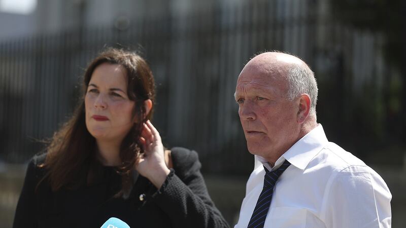 Gary Hoey and solicitor Claire McKeegan outside the High Court in Belfast. Picture by Hugh Russell