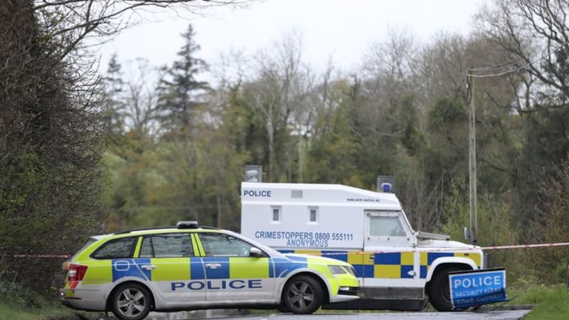 &nbsp;PSNI vehicles block a road during a security operation which has been ongoing since yesterday on the Ballyquin Road near Dungiven after a viable explosive device was found close to the home of a female PSNI officer