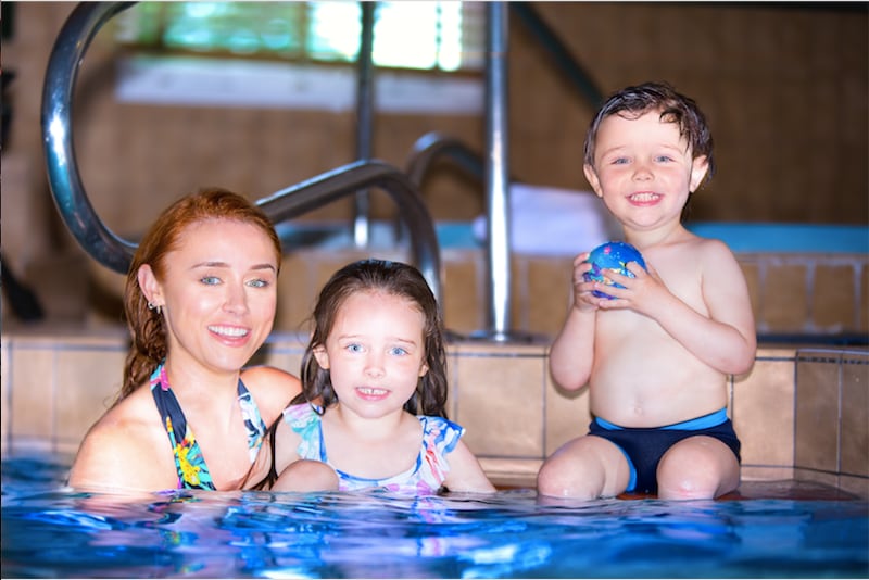 Una Healy and her children in a pool