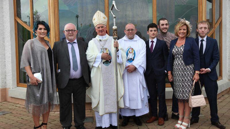 Fr James O&quot;Reilly with his family and Bishop Noel Treanor after being ordained. Picture by Ann McManus 