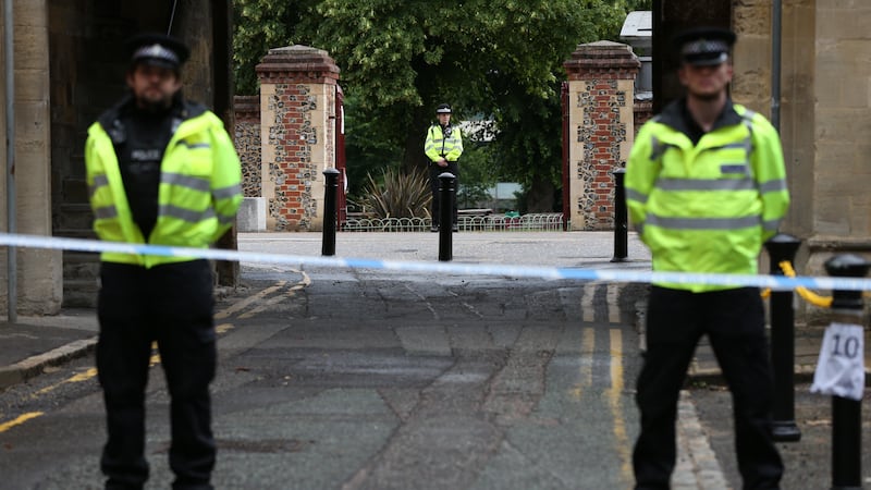 Police at the Abbey gateway of Forbury Gardens in Reading town centre following the multiple stabbing attack