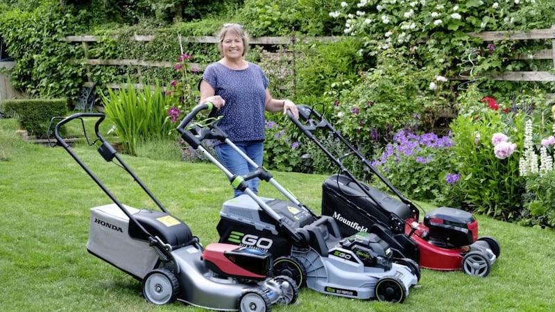 Hannah Stephenson with the three mowers she tested 