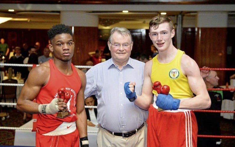 Colm Murphy with opponent Shakell Shamar Daly after their fight of the night at the Europa Hotel on Friday. Also pictured is Dr Sean Donnelly. Picture by Mark Marlow 