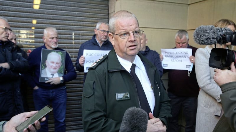 Chief Constable Simon Byrne speaks to relatives after a meeting of the Policing Board yesterday. Picture by Mal McCann. 