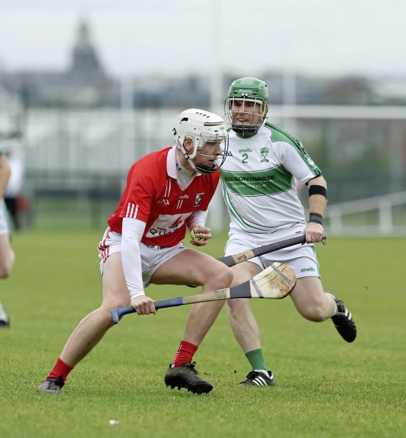 Con Magee's Brian O'Neill and Craobh Rua' Tiarnan O'Hare in action during the 2021 Ulster GAA Hurling Junior Championship semi-final between at Davitt's GAC, Belfast Picture: Philip Walsh