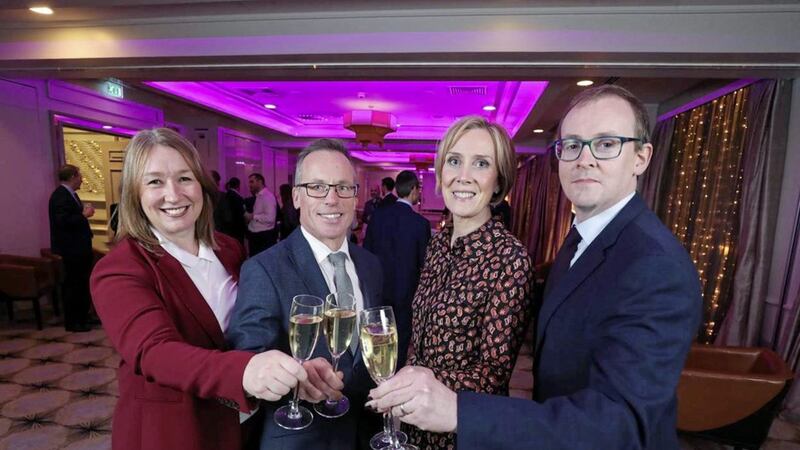 Partners Kathy McGillie (disputes), Michael McCord (disputes), Anna Beggan (employment) and Fearghal O&rsquo;Loan (banking and finance) toast Tughans being named Legal 500 Northern Ireland Law Firm of the Year 2020 