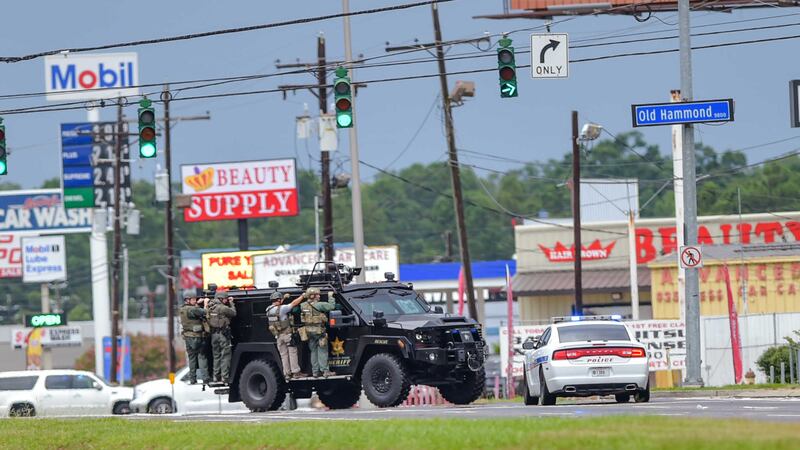 Baton Rouge Police search for a shooting suspect near Hammond Aire Shopping Center after multiple police were shot. Picture by&nbsp;Scott Clause, The Daily Advertiser/Associated Press